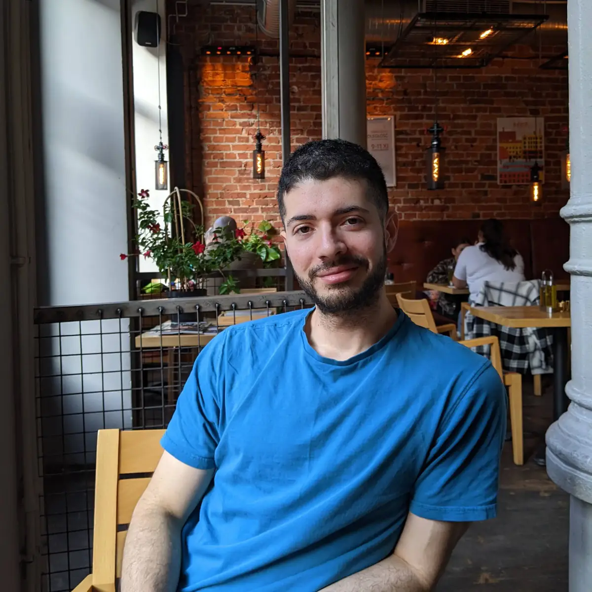 Selfie upload example for an AI clone, cafe interior and daylight